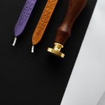 Notary public wax stamper. White envelope with brown wax seal, golden stamp. Responsive design